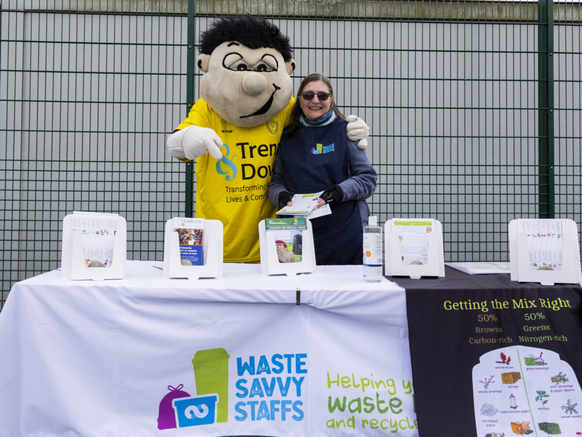 Master Composters stand at a football game